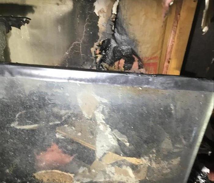 Fire damaged TV and living room