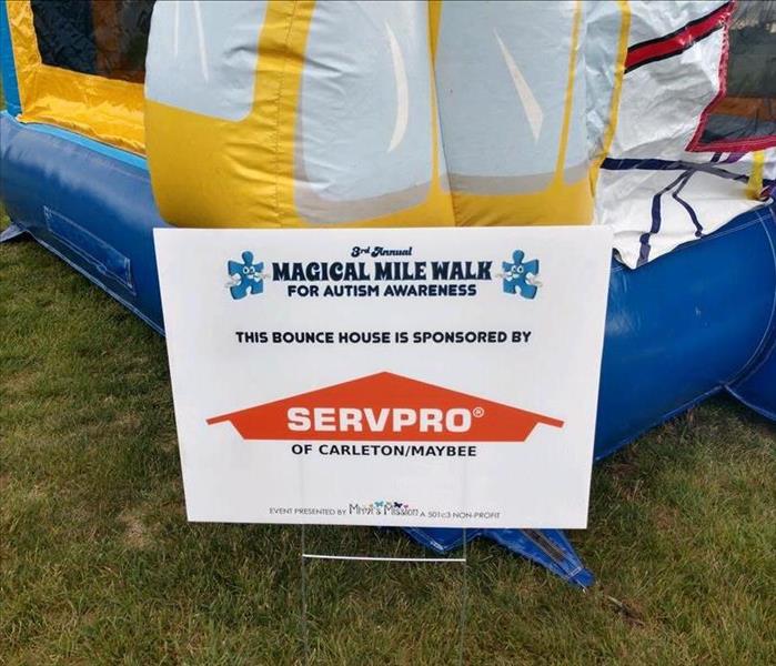 Sponsorship sign for Bounce House at Autism Awareness Walk